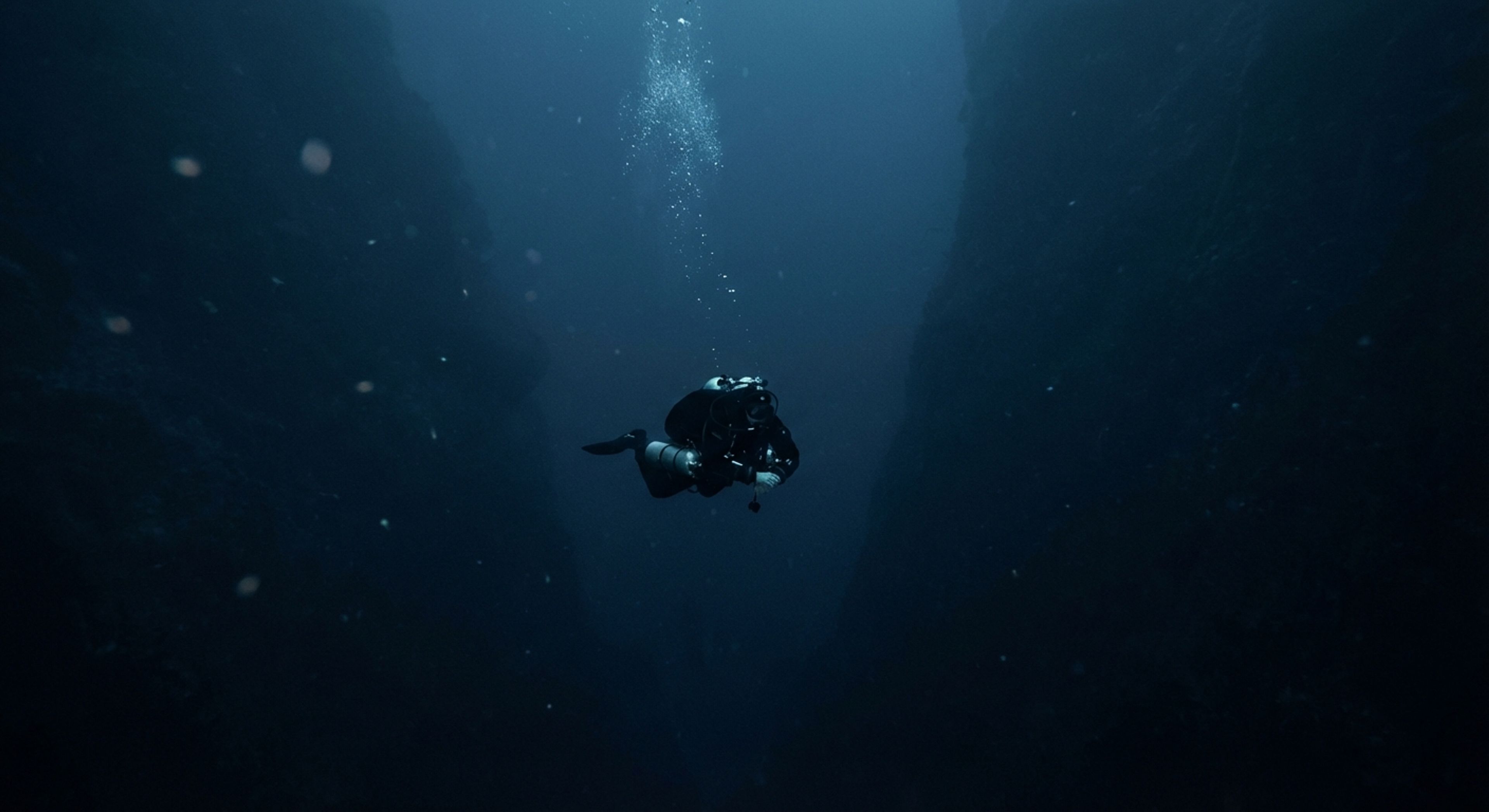 Diver in dark water
