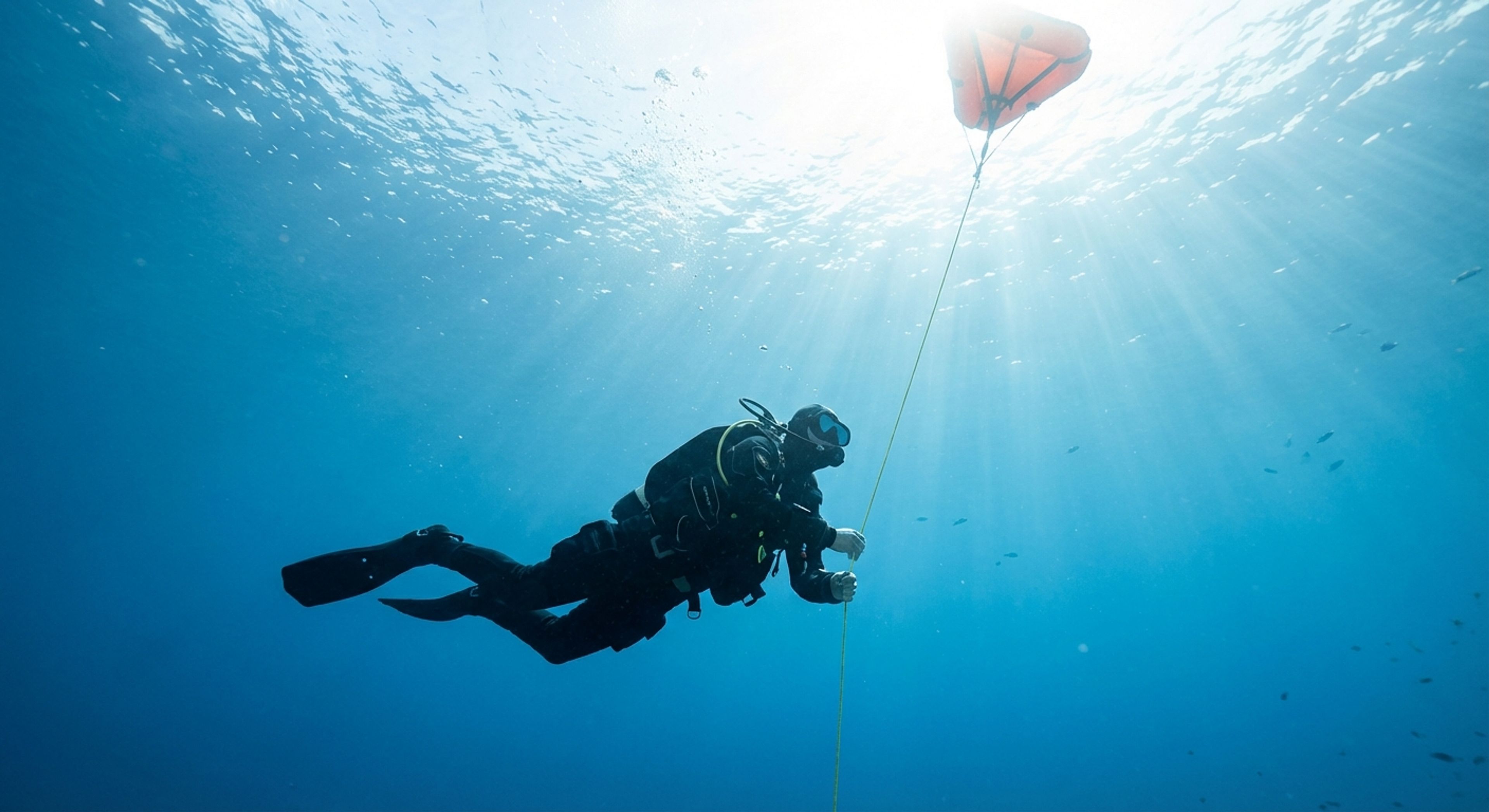 Diver at safety stop with SMB deployed